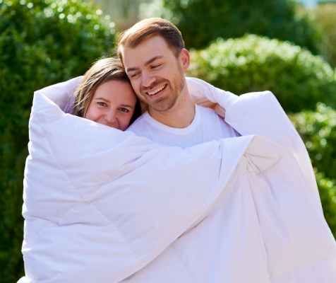 couple under comforter